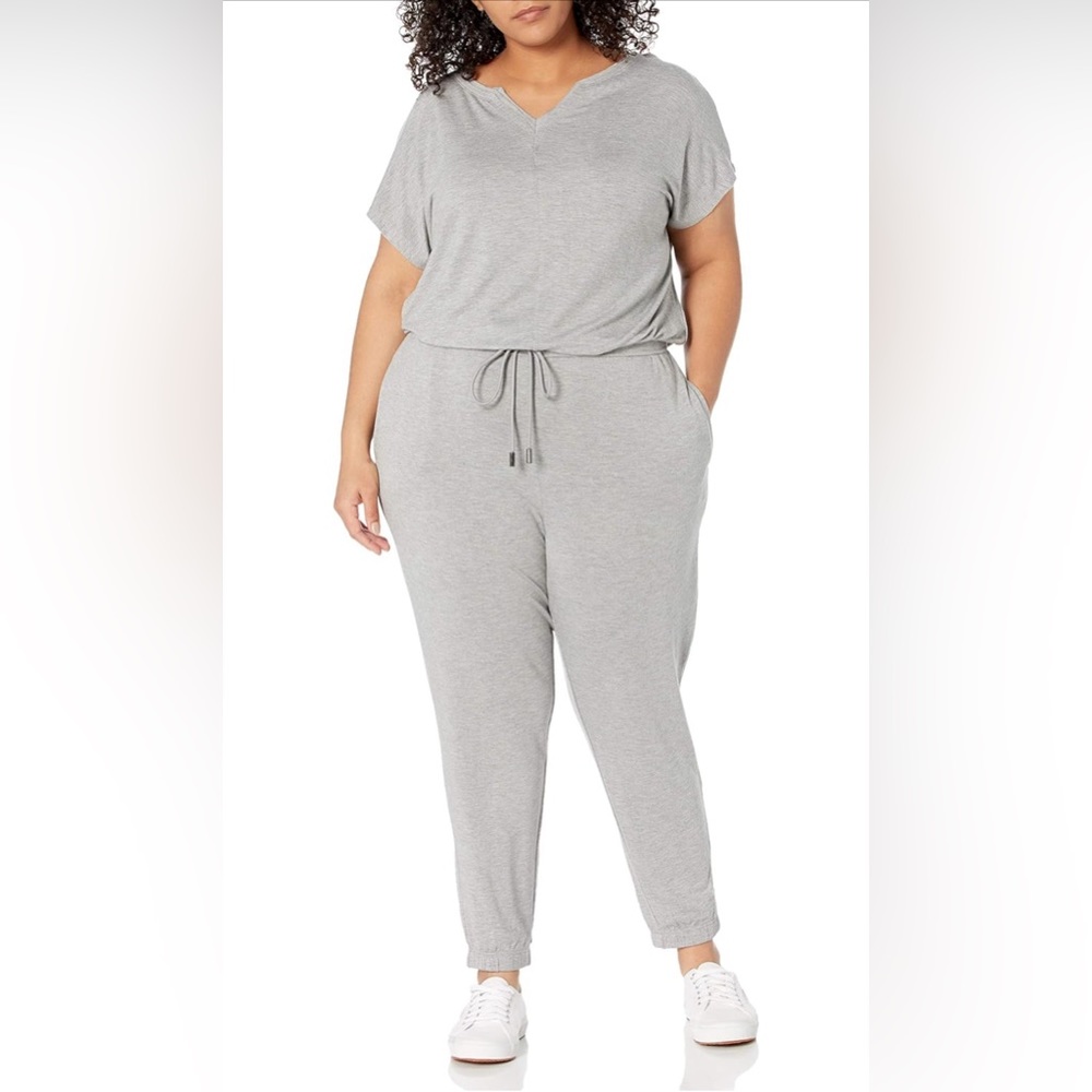NWT adorable soft jumpsuit with pockets and drawstring keyhole back raw hem